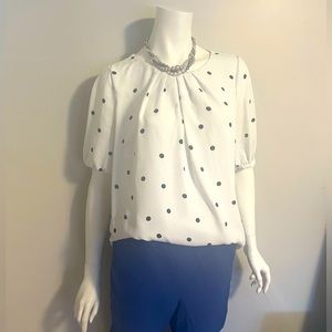 White top with blue polka dots